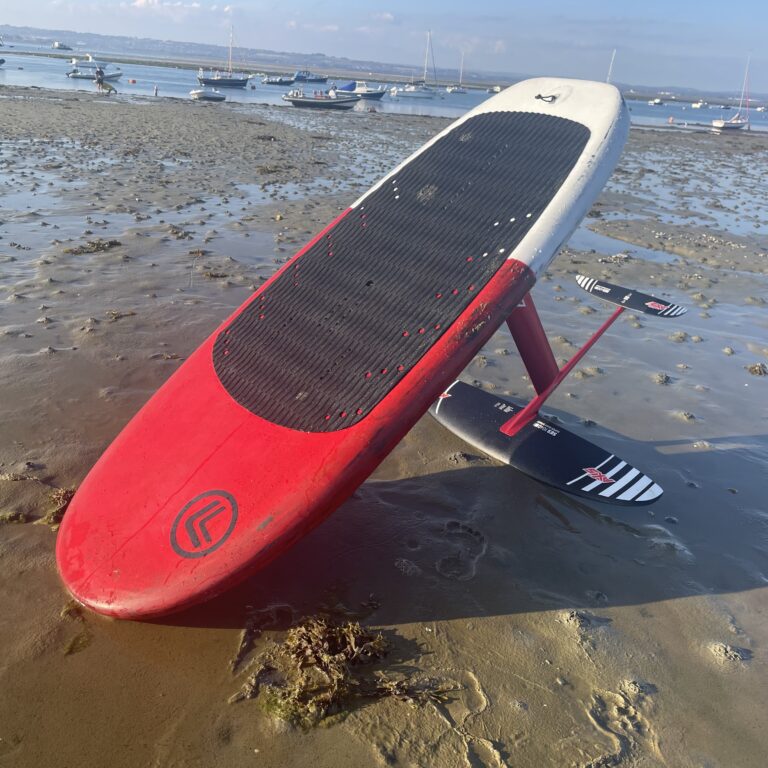 EZ 140L wing foil board on the beach